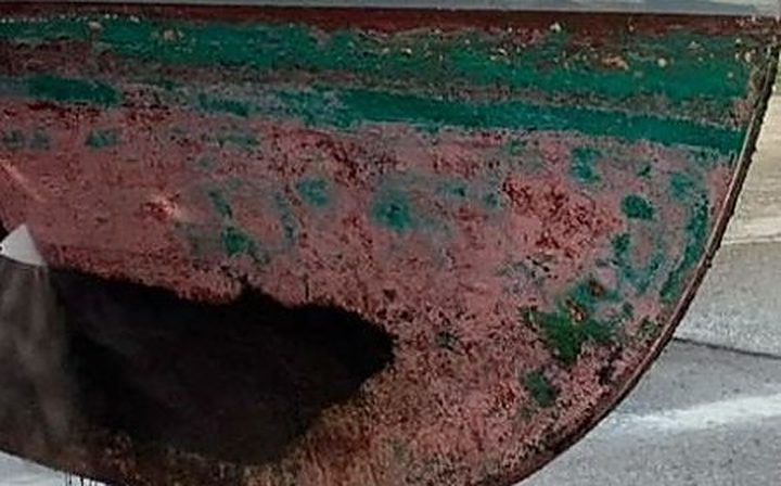 Weathered hull with layers of antifouling paint