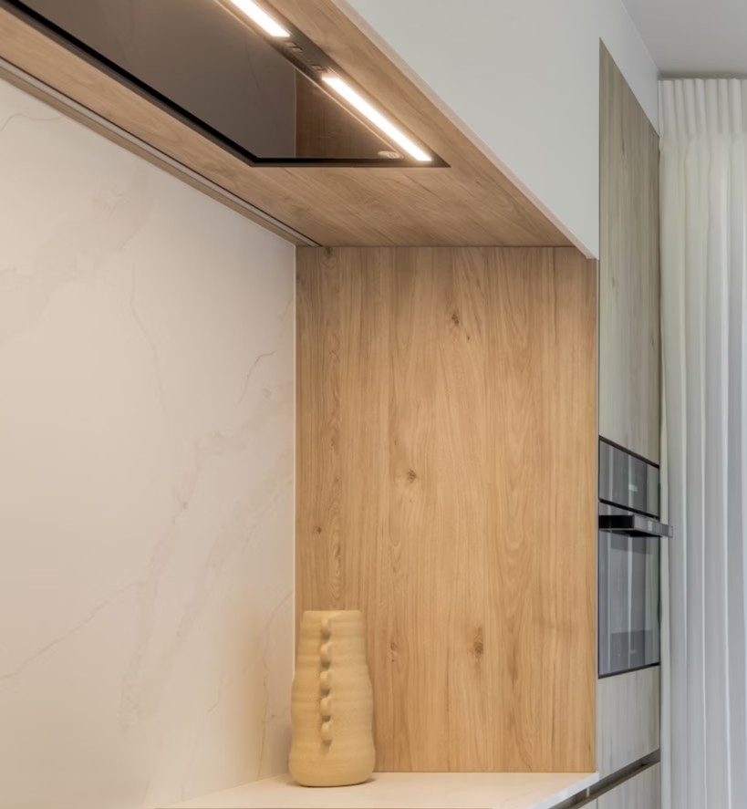 Oak cabinetry with concealed lighting