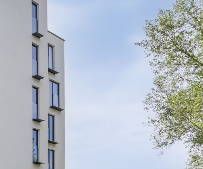 Deep window reveals on a white facade